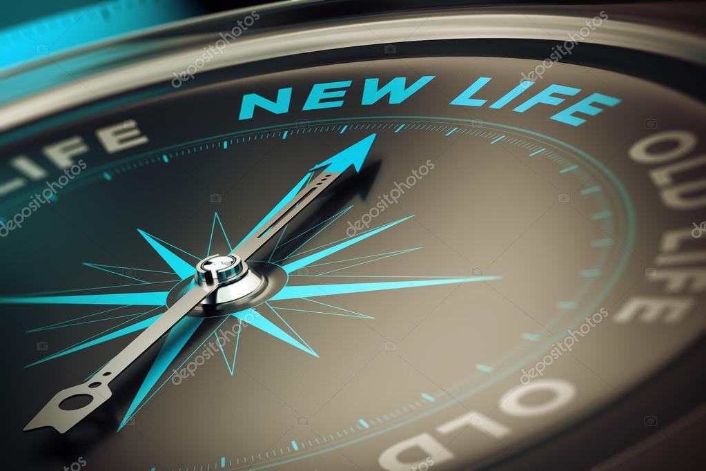 A close-up of a compass with the needle pointing toward "New Life" and "Old Life" marked on the dial.